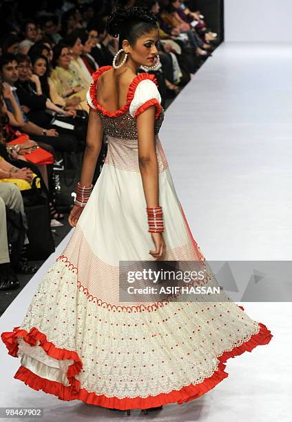 Model presents a creation by Pakistani designer Ahmed Bilal on the last day of the Karachi Fashion Week on April 9, 2010. The event is scheduled to...