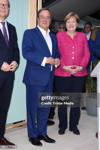 Angela Merkel and Armin Laschet attend the Landesvertretung NRW summer party on June 26, 2018 in Berlin, Germany.