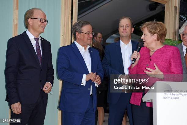 Angela Merkel, Joachim Stamp and Armin Laschet attend the Landesvertretung NRW summer party on June 26, 2018 in Berlin, Germany.