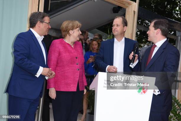 Angela Merkel, Joachim Stamp, Armin Laschet and Mark Speich attend the Landesvertretung NRW summer party on June 26, 2018 in Berlin, Germany.