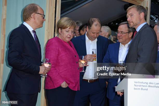 Angela Merkel, Joachim Stamp, Armin Laschet and Christian Lindner attend the Landesvertretung NRW summer party on June 26, 2018 in Berlin, Germany.