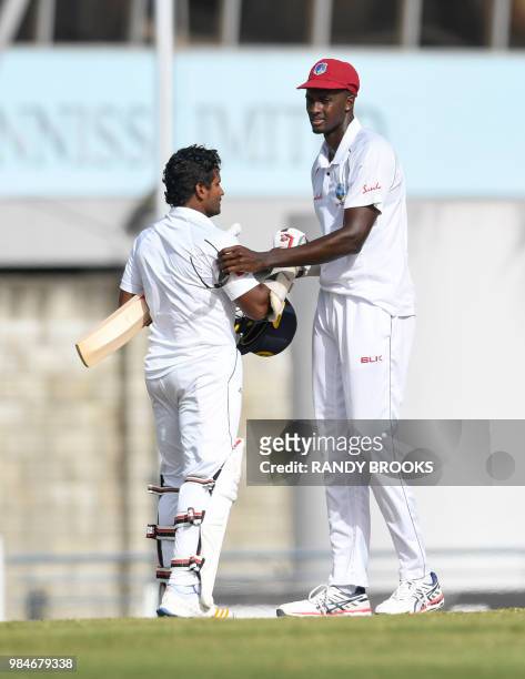 Jason Holder of West Indies congratulate Kusal Perera of Sri Lanka for winning on day 4 of the 3rd Test between West Indies and Sri Lanka at...