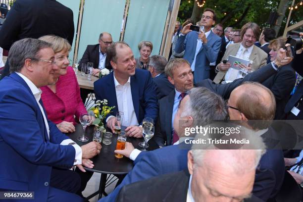 Angela Merkel, Joachim Stamp, Armin Laschet and Christian Lindner attend the Landesvertretung NRW summer party on June 26, 2018 in Berlin, Germany.