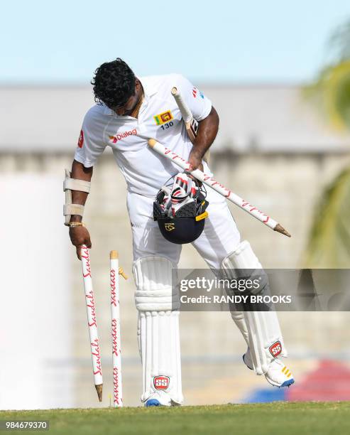 Kusal Perera of Sri Lanka takes the stumps on day 4 of the 3rd Test between West Indies and Sri Lanka at Kensington Oval, Bridgetown, Barbados, on...