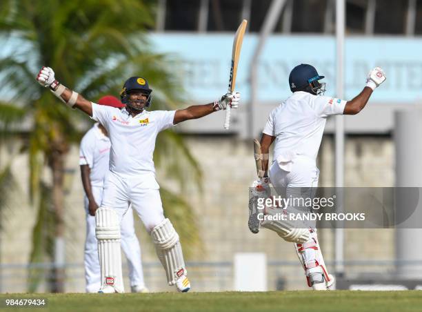 Kusal Perera and Dilruwan Perera of Sri Lanka celebrate winning on day 4 of the 3rd Test between West Indies and Sri Lanka at Kensington Oval,...