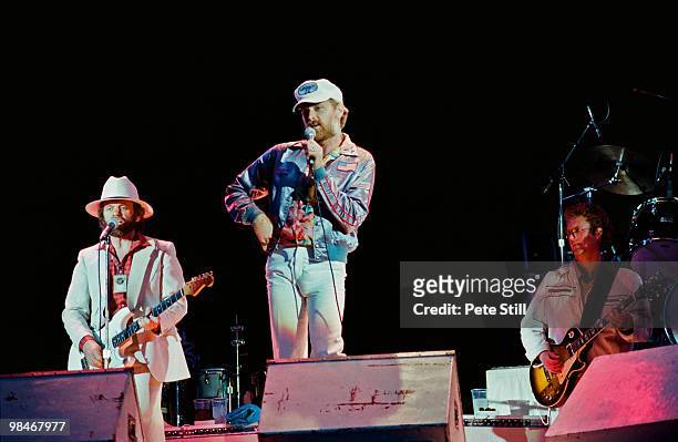 Al Jardine and Mike Love of The Beach Boys, with session musician Ed Carter perform on stage at Knebworth on June 21st, 1980 in London, England. This...