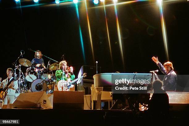 Brothers Dennis Wilson and Carl Wilson of The Beach Boys with session guitarist Ed Carter pause to sing 'Happy Birthday' and congratulate their...