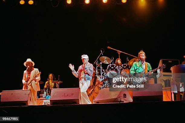 Al Jardine, Mike Love, Dennis Wilson and Carl Wilson of The Beach Boys, with session musician Bobby Figueroa on percussion , perform on stage at...