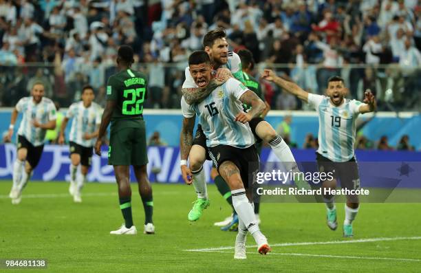 Marcos Rojo of Argentina celebrates with teammate Lionel Messi after scoring his team's second goal during the 2018 FIFA World Cup Russia group D...