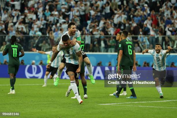 Marcos Rojo of Argentina celebrates with teammate Lionel Messi after scoring his team's second goal during the 2018 FIFA World Cup Russia group D...
