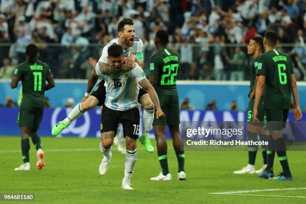 Marcos Rojo of Argentina celebrates with teammate Lionel Messi after scoring his team's second goal during the 2018 FIFA World Cup Russia group D...