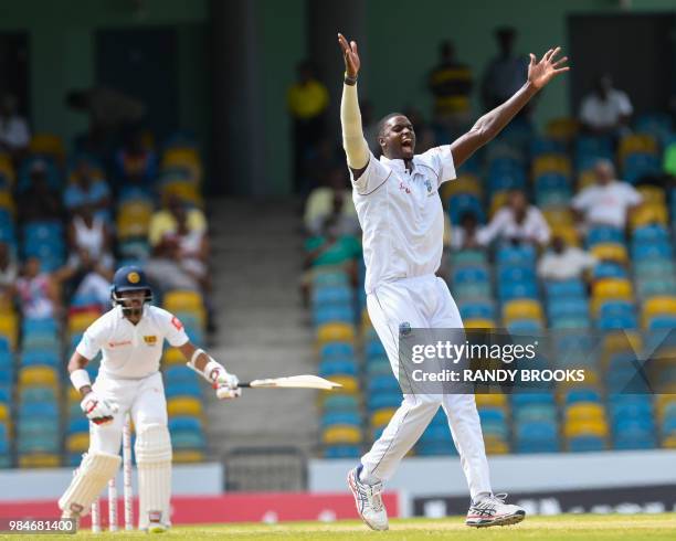 Jason Holder of West Indies celebrates the dismissal of Kusal Mendis of Sri Lanka during day 4 of the 3rd Test between West Indies and Sri Lanka at...