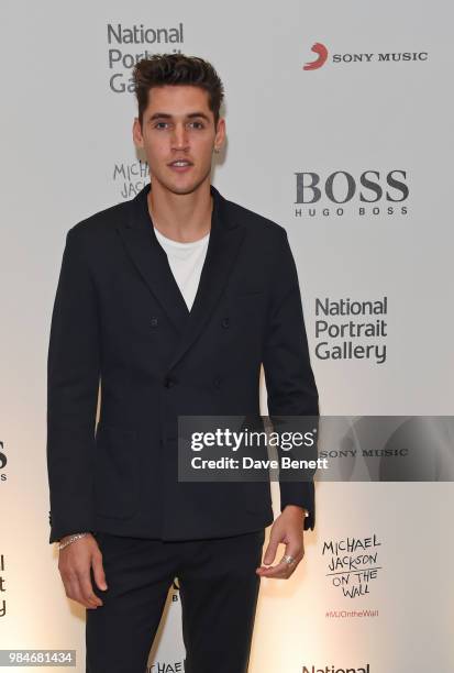 Isaac Carew attends a private view of the "Michael Jackson: On The Wall" exhibition sponsored by HUGO BOSS at the National Portrait Gallery on June...