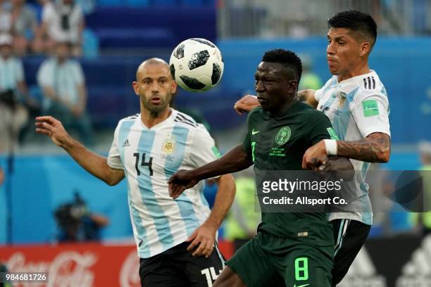 Oghenekaro Etebo of Nigeria clashes with Enzo Perez of Argentina during the 2018 FIFA World Cup Russia group D match between Nigeria and Argentina at...