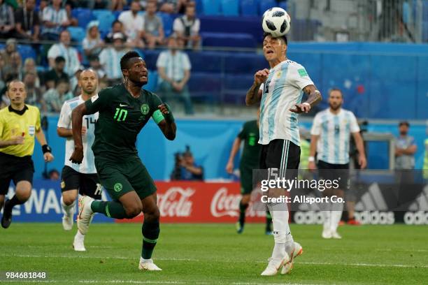 John Obi Mikel of Nigeria checks Enzo Perez of Argentina during the 2018 FIFA World Cup Russia group D match between Nigeria and Argentina at Saint...