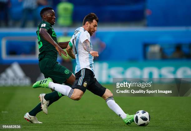 Lionel Messi of Argentina shoots to goal front of Kenneth Omeruo of Nigeria during the 2018 FIFA World Cup Russia group D match between Nigeria and...