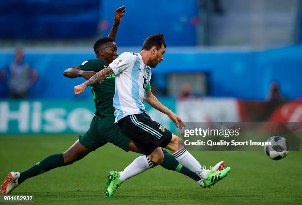 Lionel Messi of Argentina shoots to goal front of Kenneth Omeruo of Nigeria during the 2018 FIFA World Cup Russia group D match between Nigeria and...