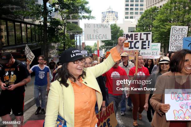 Immigration activist Maru Mora-Villalpando marches with others after her second immigration deportation hearing on June 26, 2018 in Seattle,...