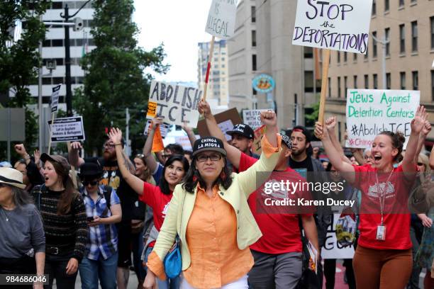 Immigration activist Maru Mora-Villalpando marches with others after her second immigration deportation hearing on June 26, 2018 in Seattle,...