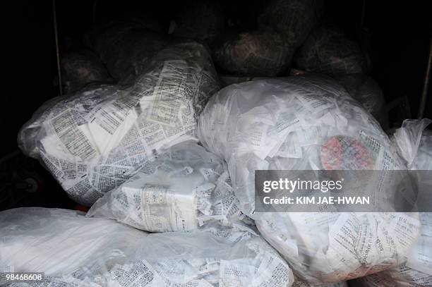 Packs of leaflets are seen in a truck before South Korean activists float them by balloons across the border into North Korea, at Paju on April 15,...