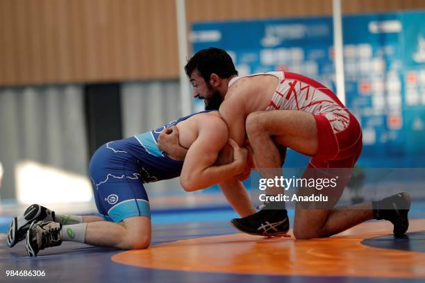 Selahattin Kilicsallayan of Turkey competes against David Habat of Slovenia in 65kg Men's Freestyle Wrestling within the XVIII Mediterranean Games...