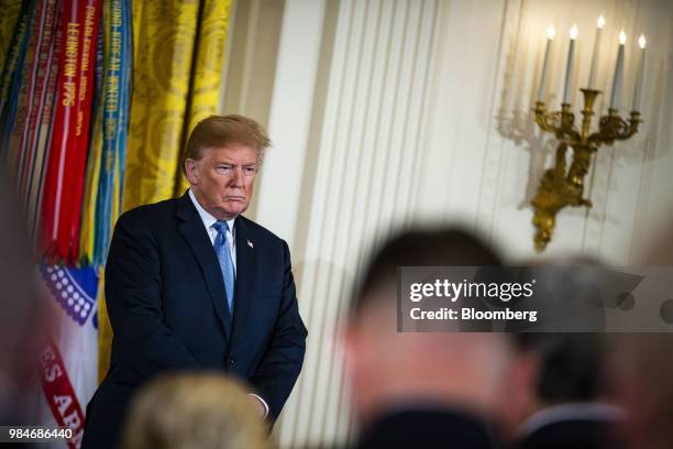 President Donald Trump listens during a Medal of Honor ceremony in the East Room of the White House in Washington, D.C., U.S., on Tuesday, June 26,...