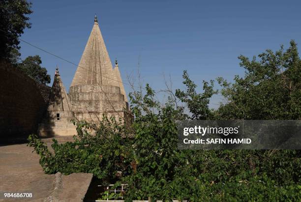 General view shows Lalish temple in a valley near Dohuk, 430 km northwest of the capital Baghdad, on June 24, 2018. At the Yazidis' most holy site in...