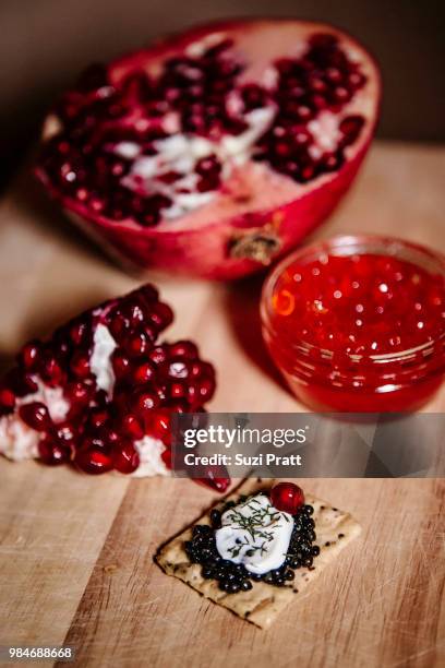 caviar and pomegranates - suzi pratt stock pictures, royalty-free photos & images