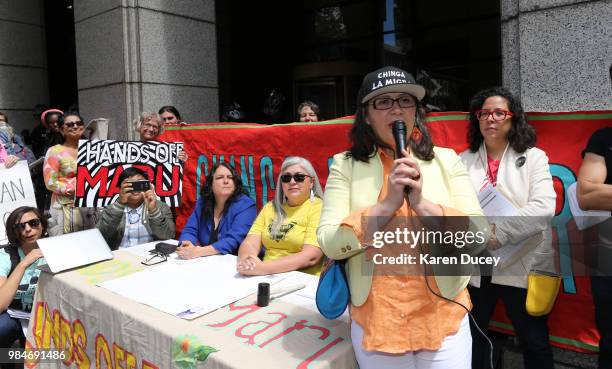 Immigration activist Maru Mora-Villalpando speaks to dozens of supporters after her second deportation hearing outside the Seattle Immigration Court...