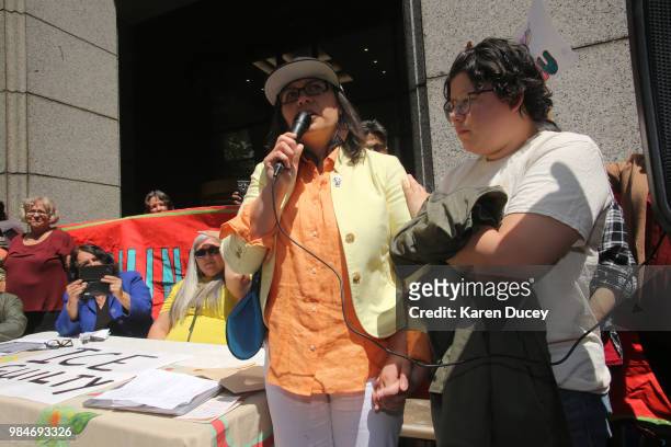 Immigration activist Maru Mora-Villalpando and her daughter, Josefina Mora address a crowd after her second deportation hearing outside the Seattle...