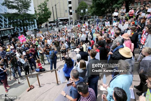 Immigration activist Maru Mora Villalpando speaks to a crowd outside the William Kenzo Nakamura United States Courthouse in reaction to today's...