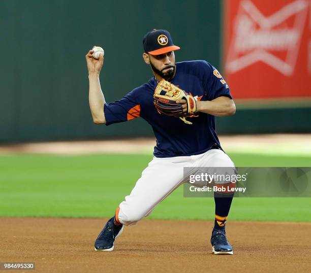 Marwin Gonzalez of the Houston Astrostakes infield practice before playing the Toronto Blue Jays at Minute Maid Park on June 26, 2018 in Houston,...