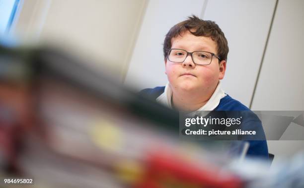 Jochen Knoop sits behind his case's files in a meeting room of his lawyer in Ludwigsburg, Germany, 12 January 2018. After a video shoot for a school...