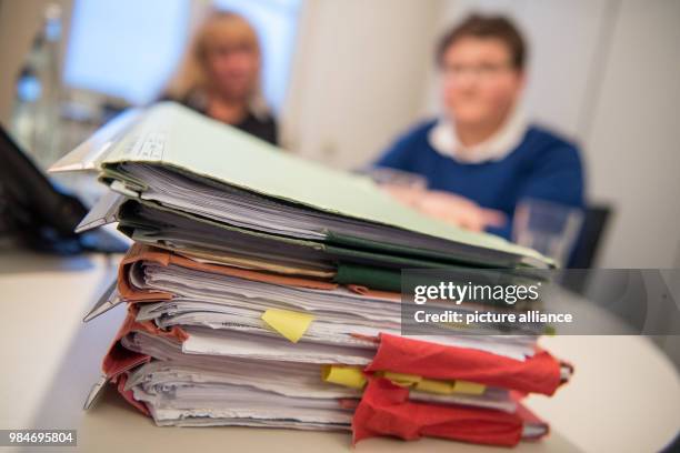 Files of Jochen Knoop's case in a meeting room of his lawyer in Ludwigsburg, Germany, 12 January 2018. After a video shoot for a school project,...