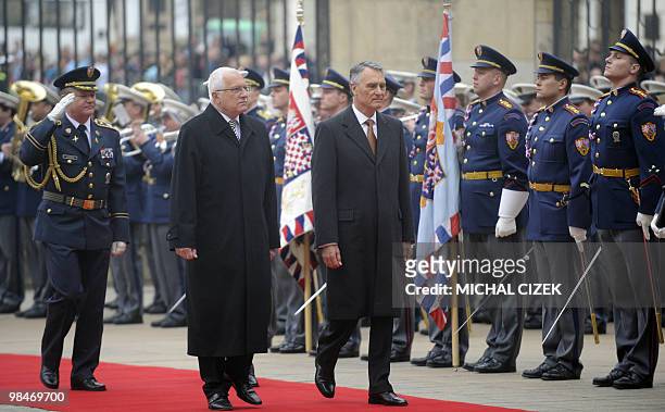Portuguese President Anibal Cavaco Silva and his Czech counterpart Vaclav Klaus review an honor guard on April 15, 2010 during a welcoming ceremony...