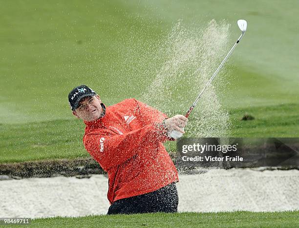 Paul Lawrie of Scotland plays a bunker shot on the 10th hole during the Round One of the Volvo China Open on April 15, 2010 in Suzhou, China.