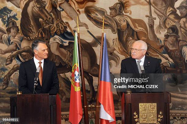 Czech President Vaclav Klaus listens to his Portuguese counterpart Anibal Cavaco Silva during their joint press conference on April 15, 2010 at the...