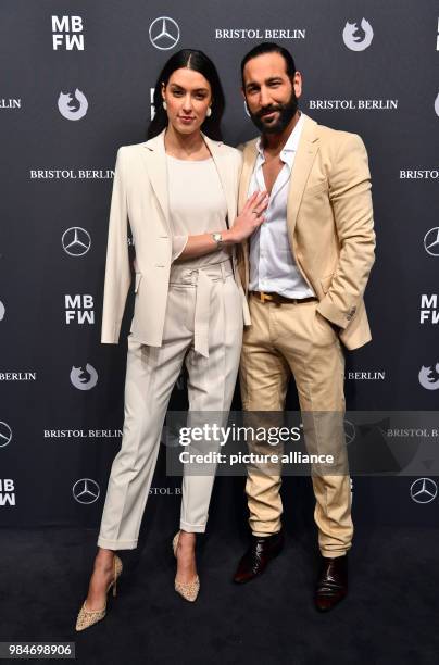 Rebecca Mir and Massimo Sinato arrive for the Riani fashion show during the Mercedes Benz Fashion Week at the ewerk in Berlin, Germany, 16 January...