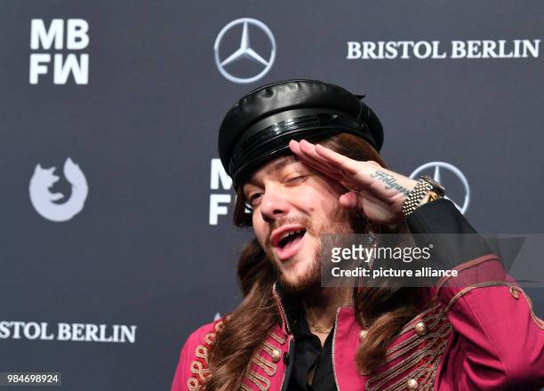 Fashion blogger Riccardo Simonetti arrives for the Riani fashion show during the Mercedes Benz Fashion Week at the ewerk in Berlin, Germany, 16...