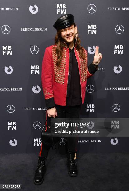 Fashion blogger Riccardo Simonetti arrives for the Riani fashion show during the Mercedes Benz Fashion Week at the ewerk in Berlin, Germany, 16...