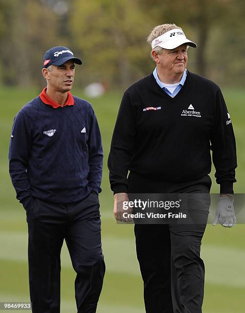 Colin Montgomerie of Scotland and Corey Pavin of USA walk on the 9th green during the Round One of the Volvo China Open on April 15, 2010 in Suzhou,...