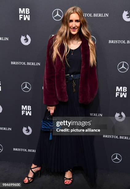 Fashion blogger Leslie Huhn arrives for the Riani fashion show during the Mercedes Benz Fashion Week at the ewerk in Berlin, Germany, 16 January...