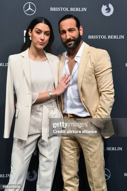 Rebecca Mir and Massimo Sinato arrive for the Riani fashion show during the Mercedes Benz Fashion Week at the ewerk in Berlin, Germany, 16 January...