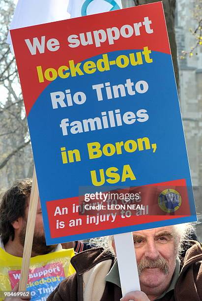 Protestor demonstrates outside the QE2 centre in central London as Anglo-Australian mining company Rio Tinto holds it's annual general meeting on...