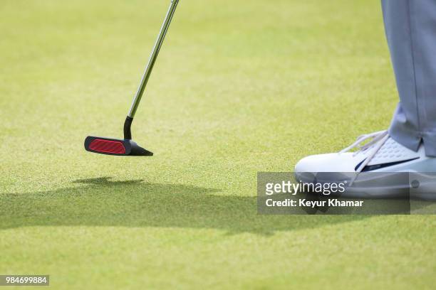 Detail shot as Tiger Woods tests a TaylorMade Ardmore 3 mallet putter on the 16th hole during practice for the Quicken Loans National at TPC Potomac...