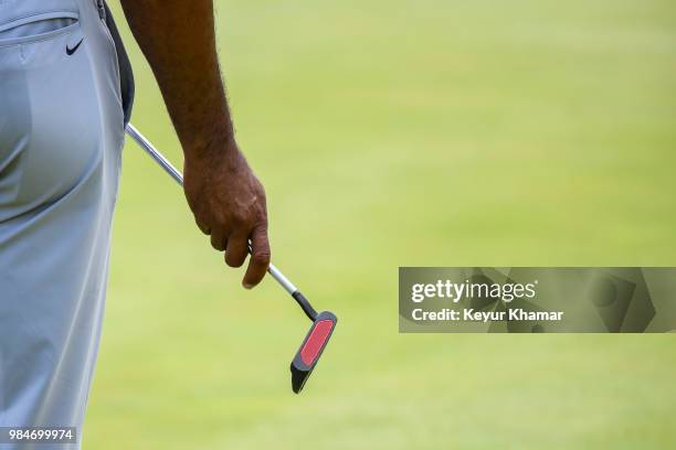 Detail shot as Tiger Woods holds a TaylorMade Ardmore 3 mallet putter on the 17th hole during practice for the Quicken Loans National at TPC Potomac...