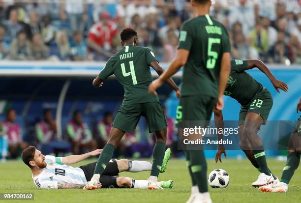 Lionel Messi of Argentina in action against Kenneth Omeruo and Wilfred Ndidi of Nigeria during the 2018 FIFA World Cup Russia Group D match between...