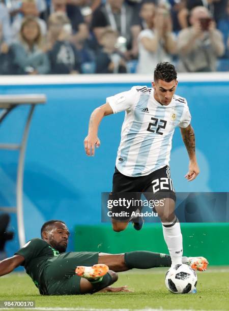 Cristian Pavon of Argentina in action against Kenneth Omeruo of Nigeria during the 2018 FIFA World Cup Russia Group D match between Nigeria and...
