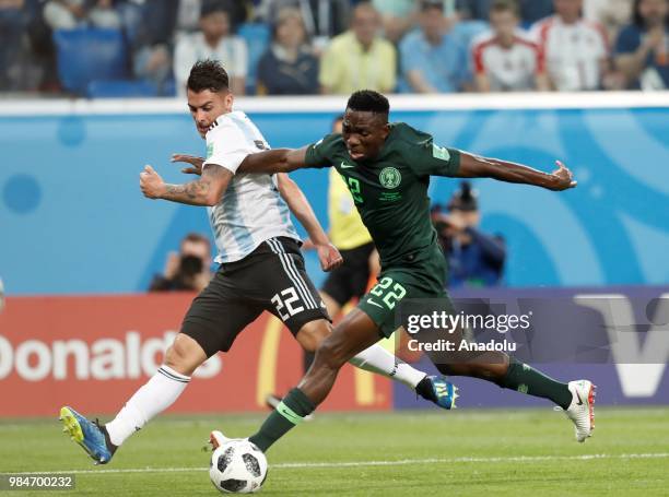 Cristian Pavon of Argentina in action against Kenneth Omeruo of Nigeria during the 2018 FIFA World Cup Russia Group D match between Nigeria and...
