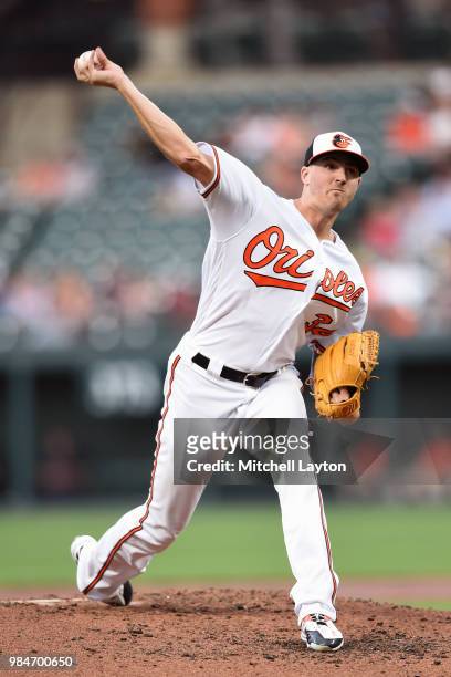 Kevin Gausman of the Baltimore Orioles pitches in the third inning during a baseball game against the Seattle Mariners at Oriole Park at Camden Yards...